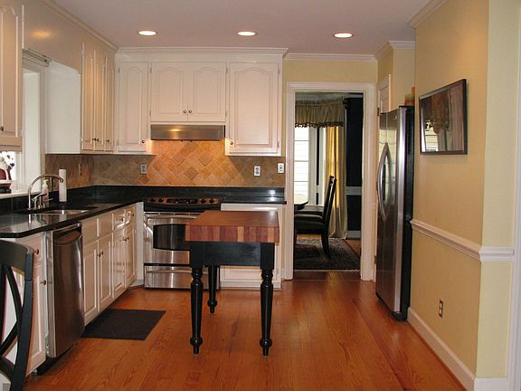 Renovated kitchen with door into dining room