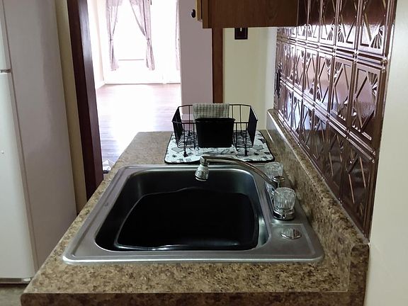 Kitchen to dining and living rooms.