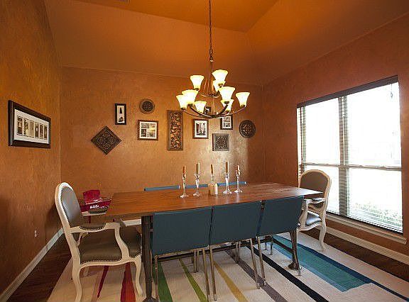 Formal dining room has natural lighting