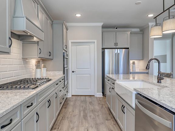 The kitchen is flooded with natural light