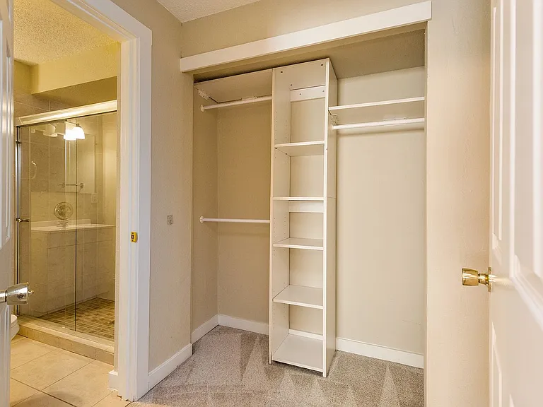 Primary bedroom, walk-in closet, and private bath