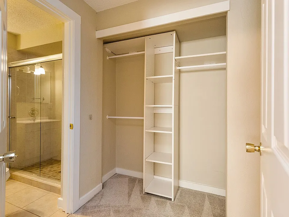 Primary bedroom, walk-in closet, and private bath
