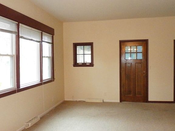 Check out the living room that has original wood work.