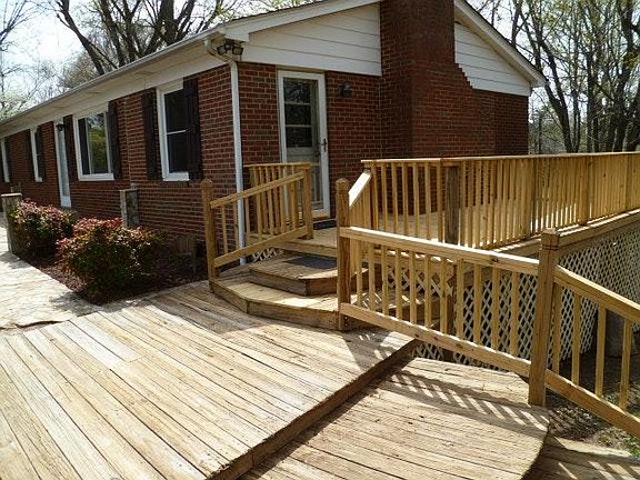 Brick ranch Home w/ Deck Overlooking 1+ Ac. Shaded Backyard