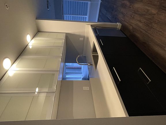 Kitchen: Sink w garbage disposal, quartz counters, frosted glass cabinet, dishwasher