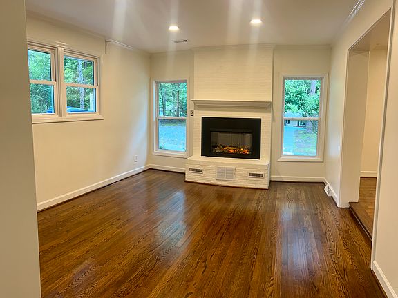 roomy den with electric fireplace