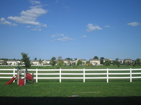 Back facing beautiful community park and swimming pool
