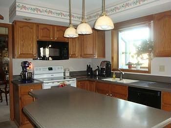Great working kitchen, large island and newer ceramic tile in kitchen and dinette area. Garden window over the sink.