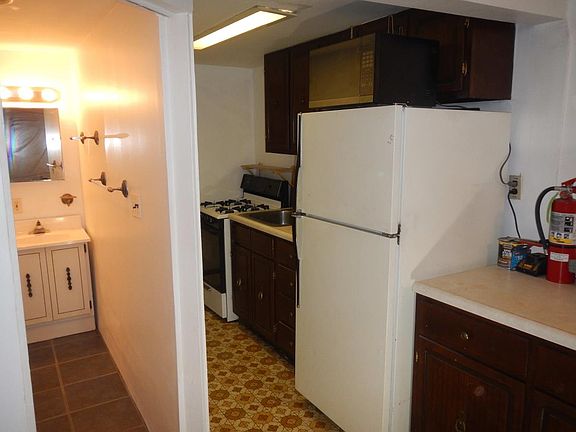 Galley kitchen & tiled bath