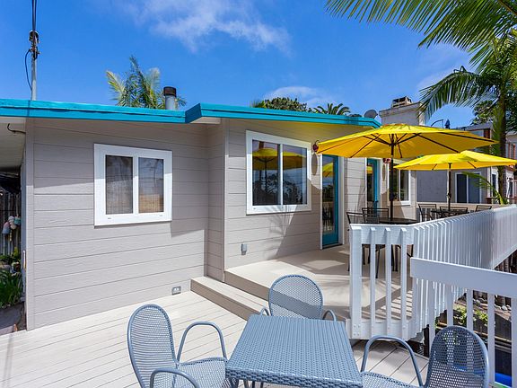 Private back patio with multiple seating areas