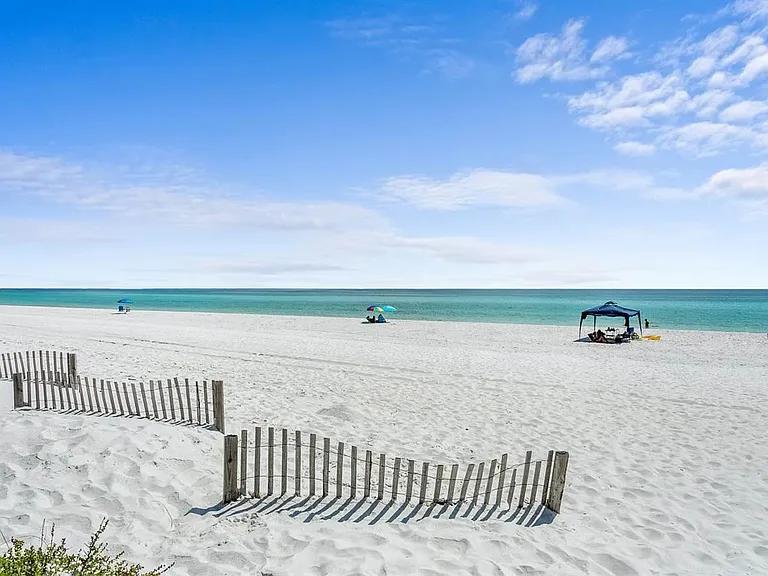 Steps to beautiful white powdered sand and surf! Never too crowded.