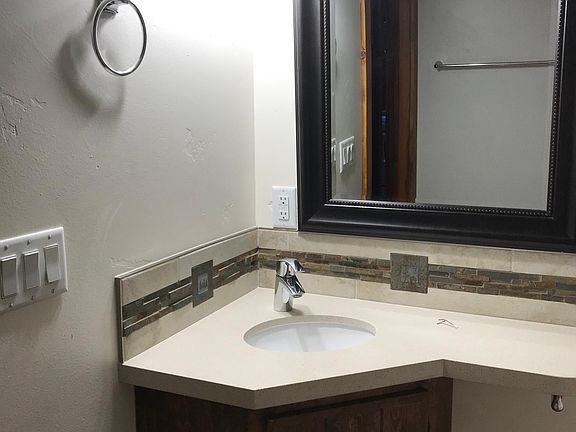 Bathroom with custom backsplash