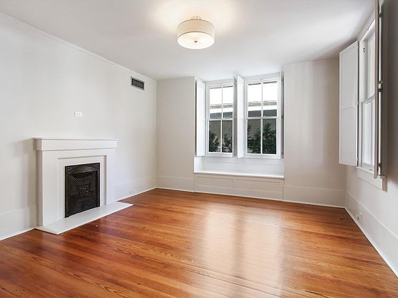Living room with decorative fireplace.