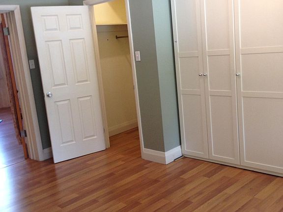 Bedroom with lots of closets