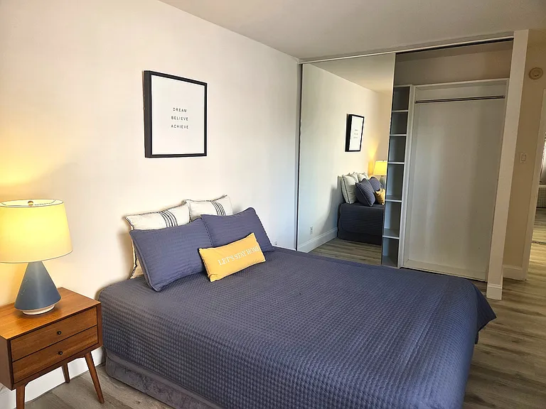 402 Bedroom with large mirrored closet