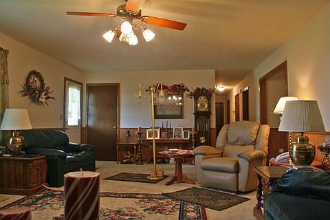 Large living room with wainscoting,sr ceil'g & wall