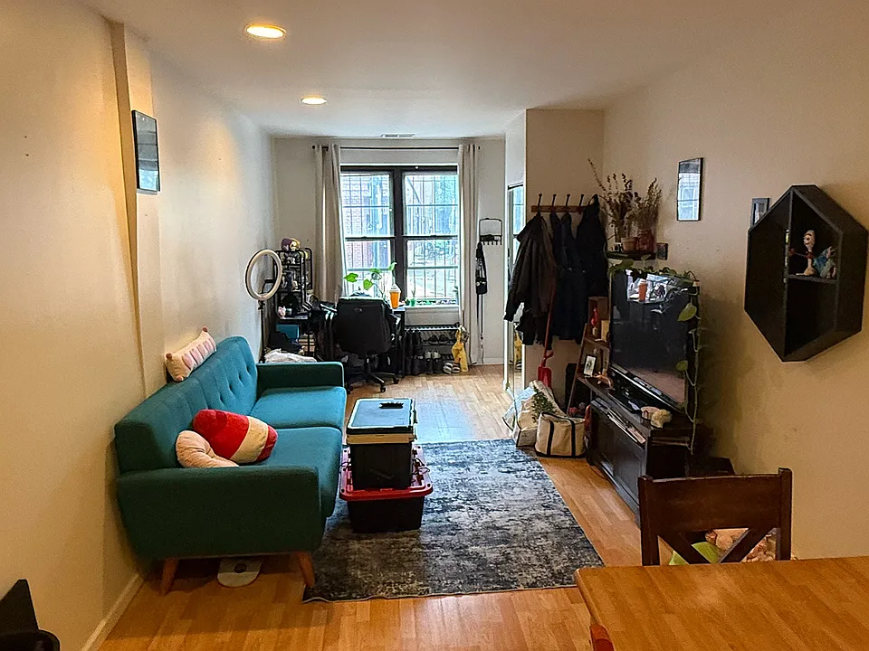 Opposite view, from Dining room to Living room, to apartment's entrance