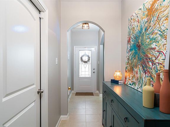 Once inside, natural light flows in accentuates the warm tile.