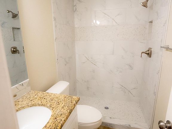 New walk-in shower (glass door added after photo was taken), new cabinets,