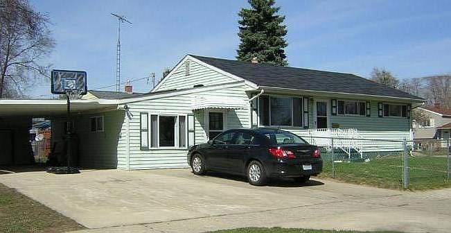 Beautiful home with spacious driveway and fenced in yard.