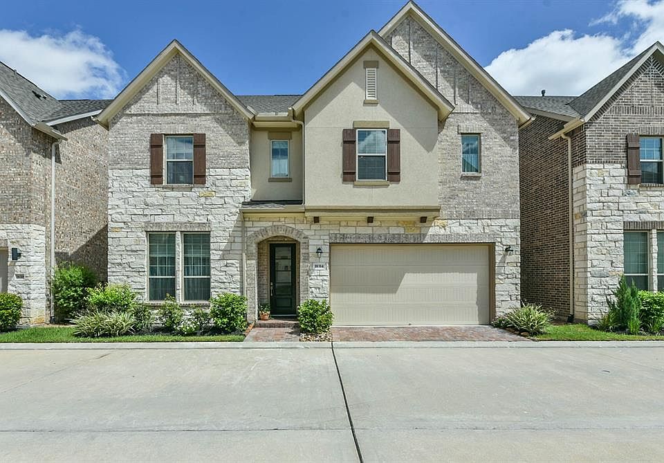 Welcome Home! 18314 Harmony Bluff Lane in the secluded gated community of Arcadia Court is ready for you to make it your new home!