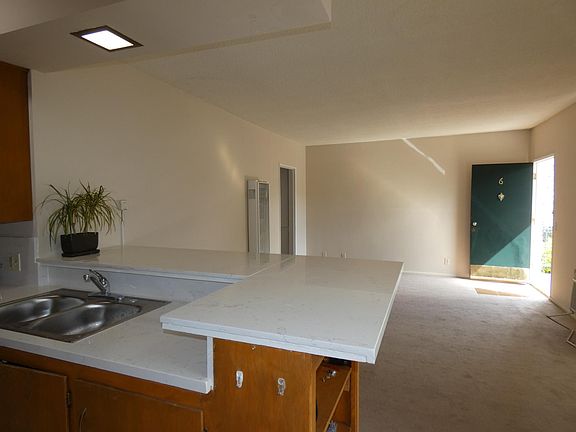 Large living room, front door at far end of this photo. Camera located in the dining area.