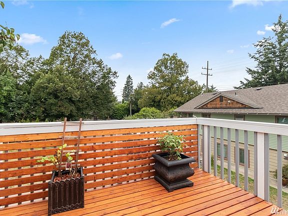 Deck off of the upstairs living room is perfect for expanding your entertaining area during the nice weather.
