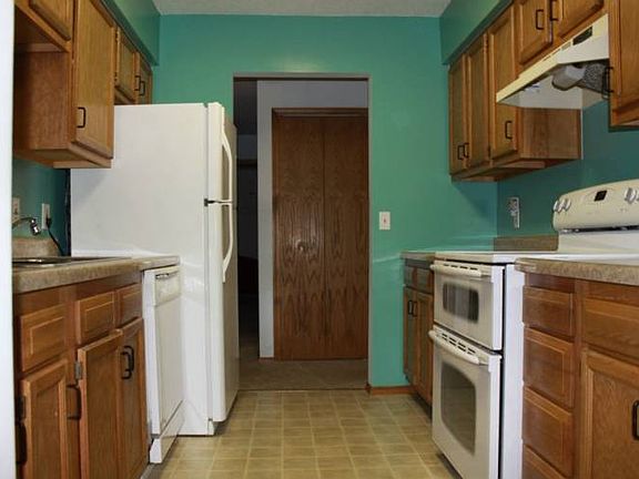 An efficient kitchen offers plenty of counter space and a pass through to the dining area!