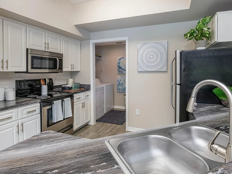 Experience the luxury of a newly remodeled kitchen with high-end finishes and modern appliances.