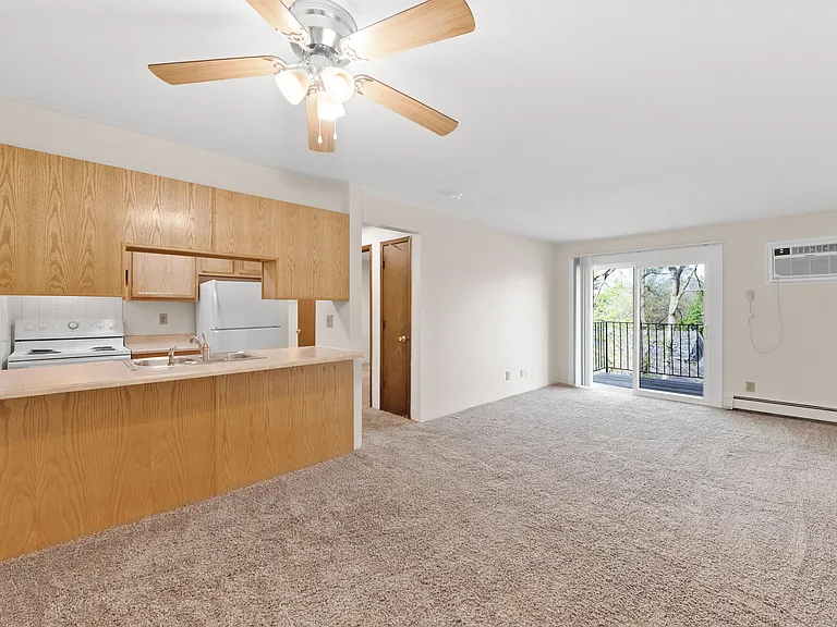 Living room with wall unit air conditioning