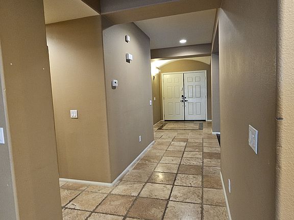 Double-door entry way leading to the family room and kitchen. Very Beautiful.