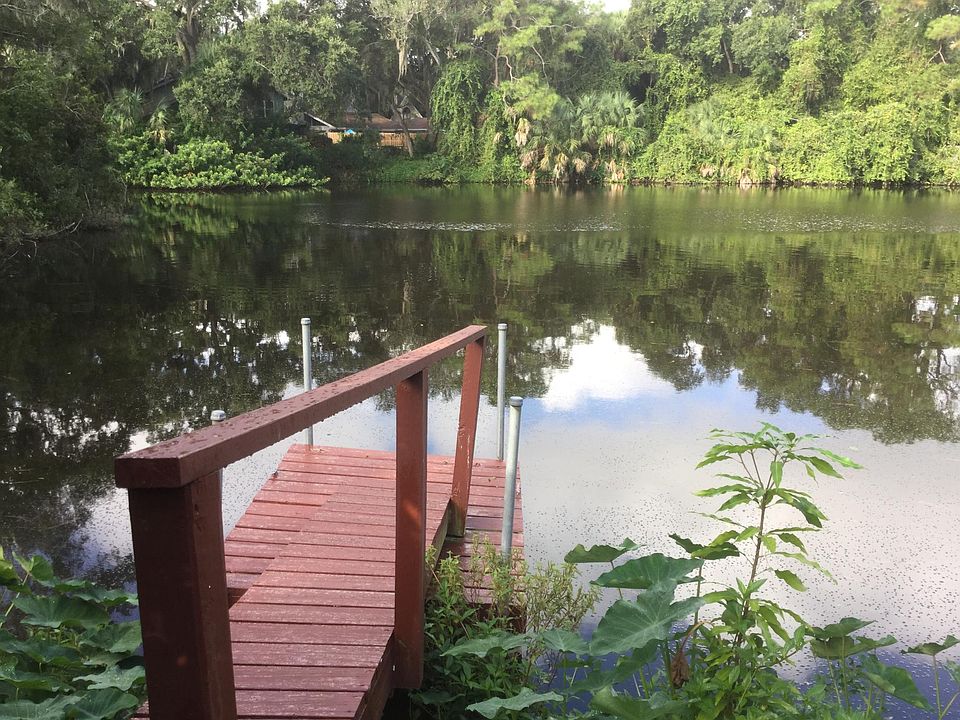 Located across from a natural lake and next to a bird sanctuary