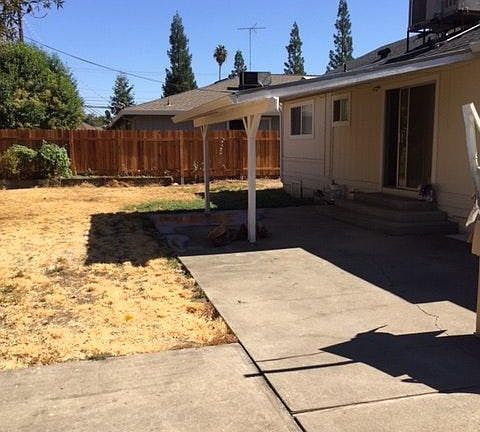 large backyard with overhang