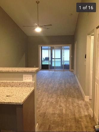 Living Room leading into screened-in patio.