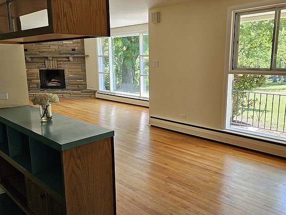 From kitchen into diningroom and livingroom with propane fireplace