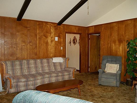 Rich paneling surrounds the den.