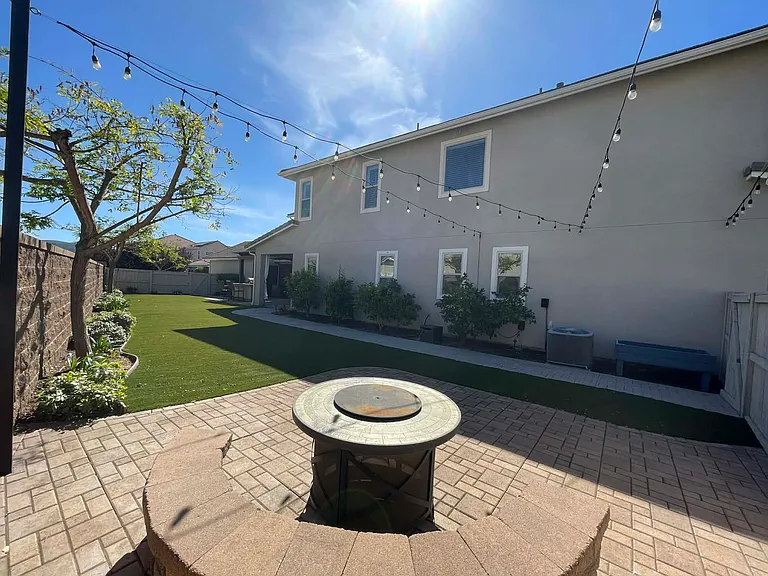 Seating wall and firepit on pavers.