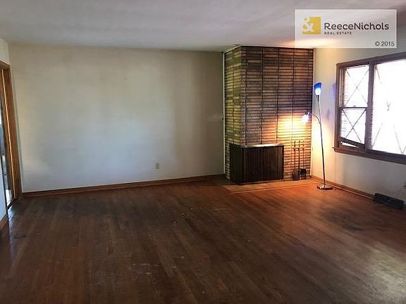 Corner fireplace in living room creates nice wall space for a large TV.