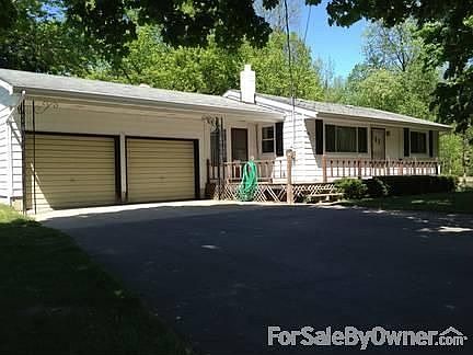 Main View
						:
						Spacious deck for outdoor seating and large driveway for multiple cars.