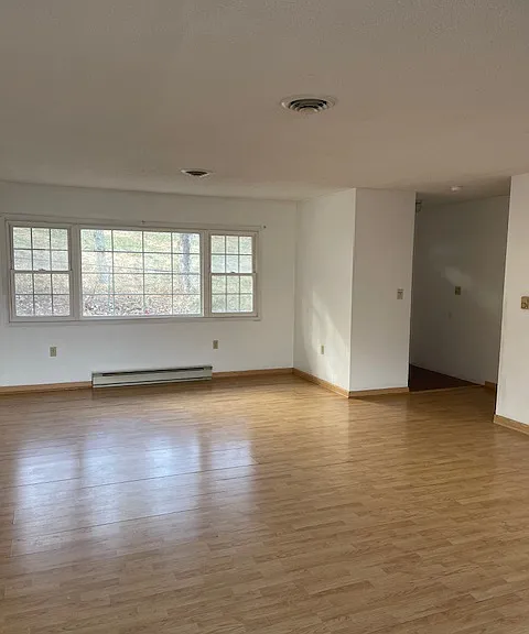 Very large Living room with two large bay windows
