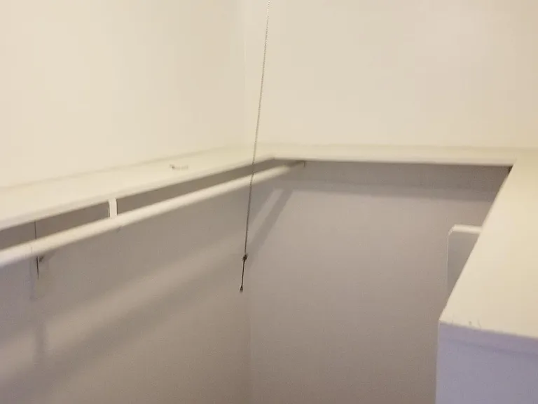 Built-in shelving above with Cabinet space for shoes, etc...