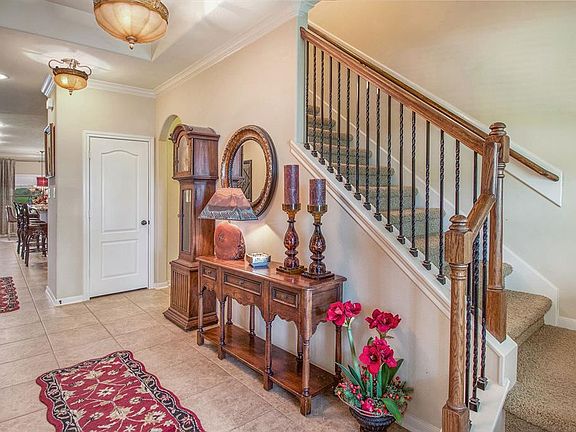 From the foyer this home has great design and flows well. The stairs lead to the enormous game room.