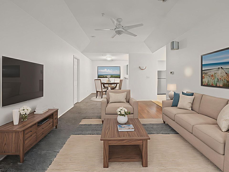 staged living room and dining room photo - OPEN FLOOR PLAN!