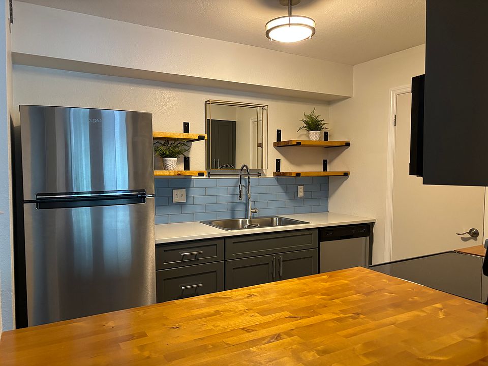 Solid wood kitchen cabinets w/ soft close drawers and doors. Quartz countertops and butcher block island. Stainless steel appliances.