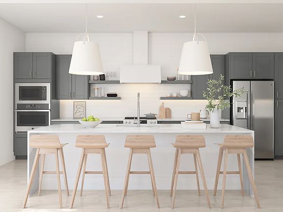 Kitchen with vast island pendant lights