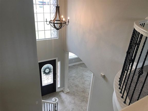 A peek from the gameroom overlooking the foyer.