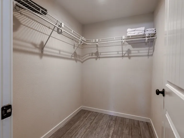 Walk in closet in primary bedroom