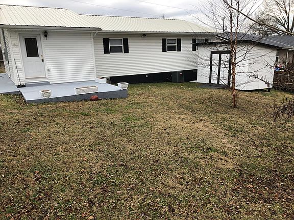 Fenced in Backyard and Storage Building