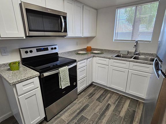 New Kitchen with New Cabinets, New Countertops, New Stainless Appliance Package, New Lighting, New Sink and Plumbing