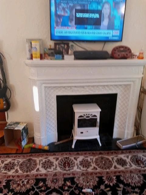 Fireplace in living room/hardwood floors